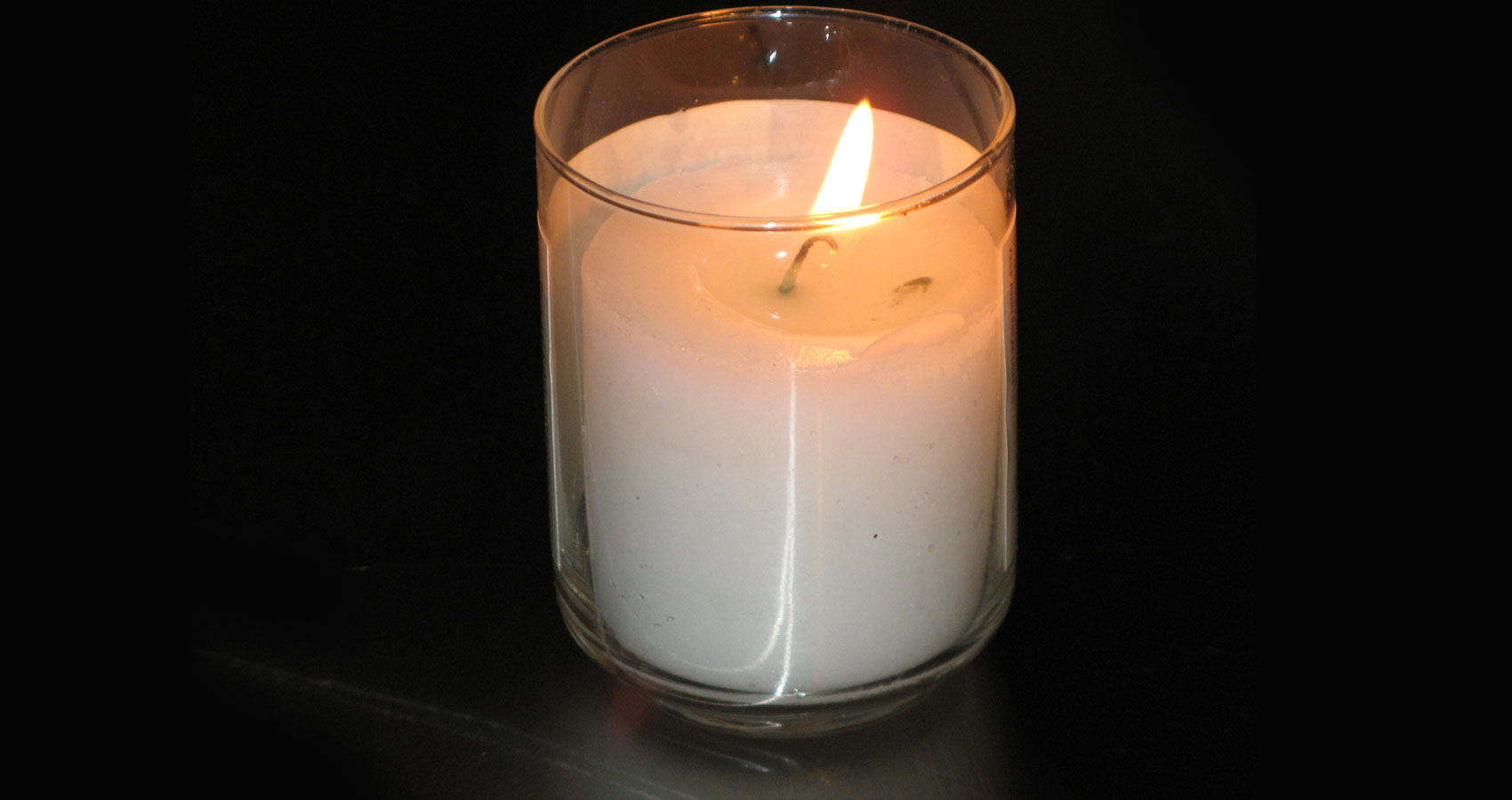 Watching Candles Burn, a poem written by Mark Tulin at Spillwords.com