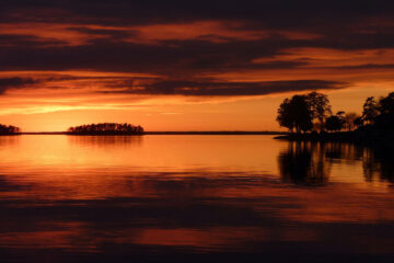 Calm Waters Of Time Below An Orangey Sky, poetry by Linda Imbler at Spillwords.com