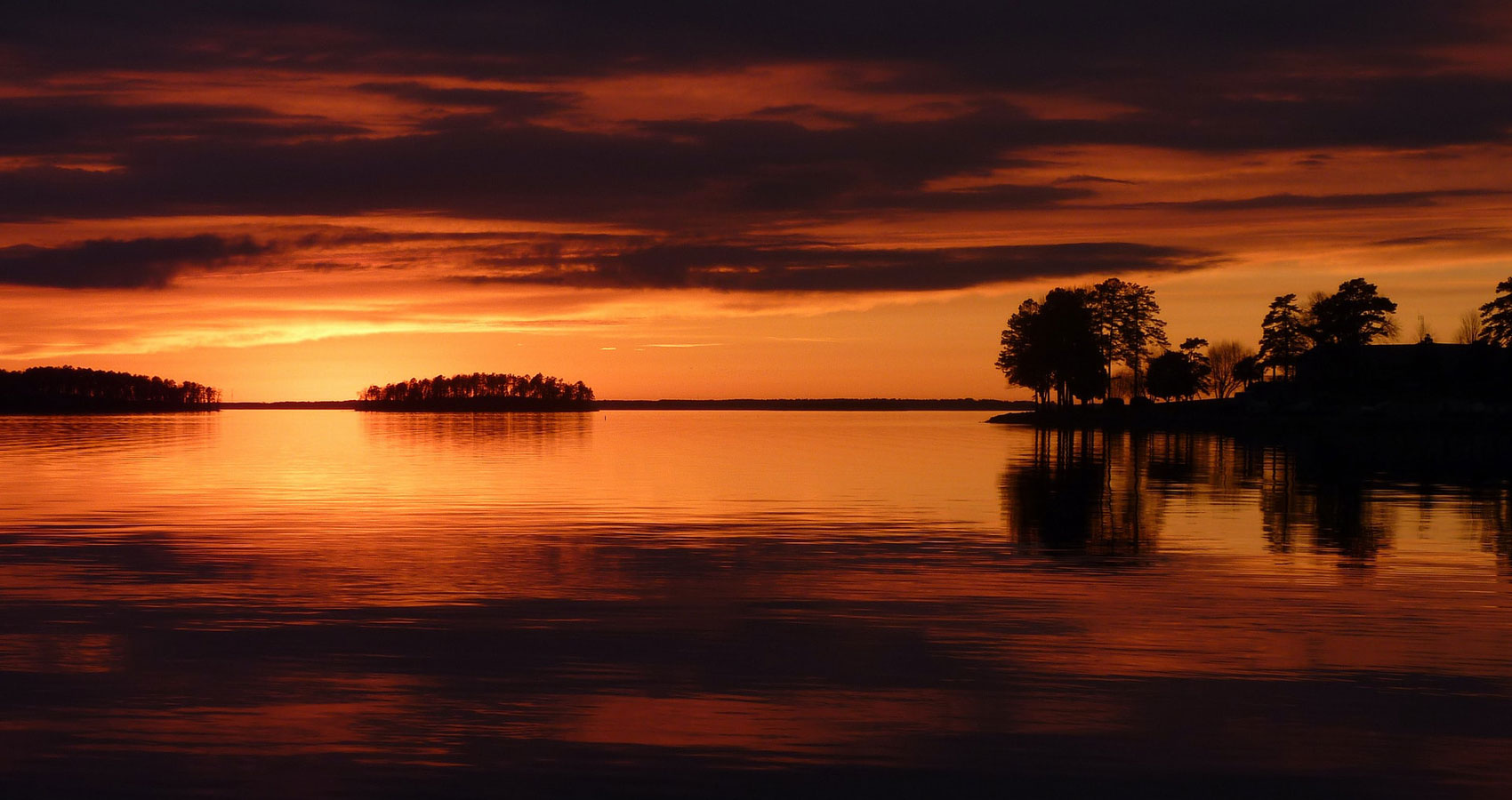 Calm Waters Of Time Below An Orangey Sky, poetry by Linda Imbler at Spillwords.com