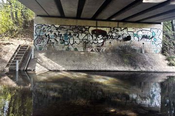 Damp River Wall, a poem by A.T. at Spillwords.com